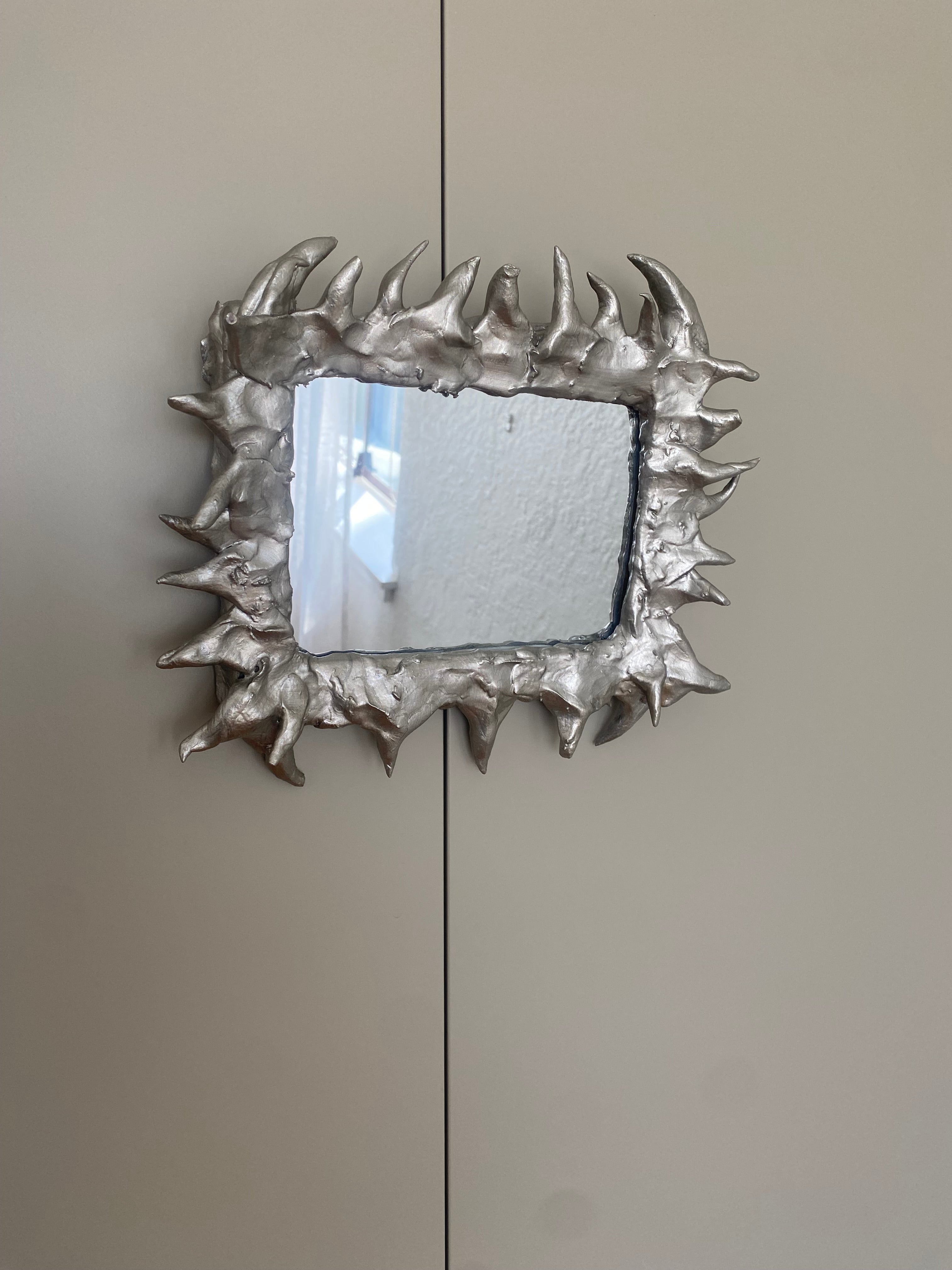 Little spikey handmade mirror